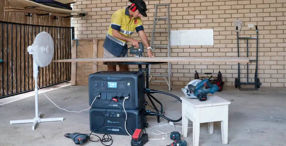 Construction worker using a power tool with Bluetti AC180P Solar Portable Power Station