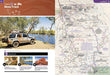 Two-page spread of Hema Maps Great Desert Tracks Atlas and Guide with Australian landscapes